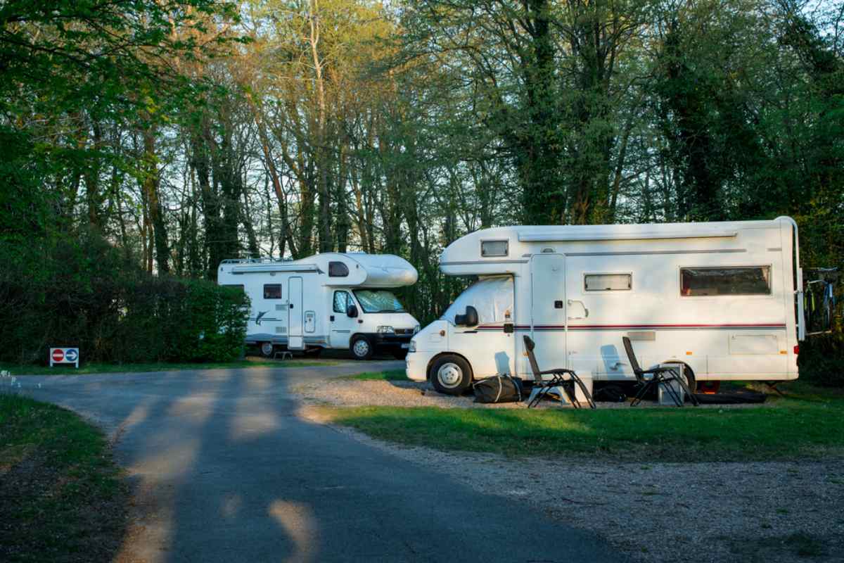 Campers and motorhomes in Northern Sweden Motorhomes parked at a quiet forest campground in northern Sweden.