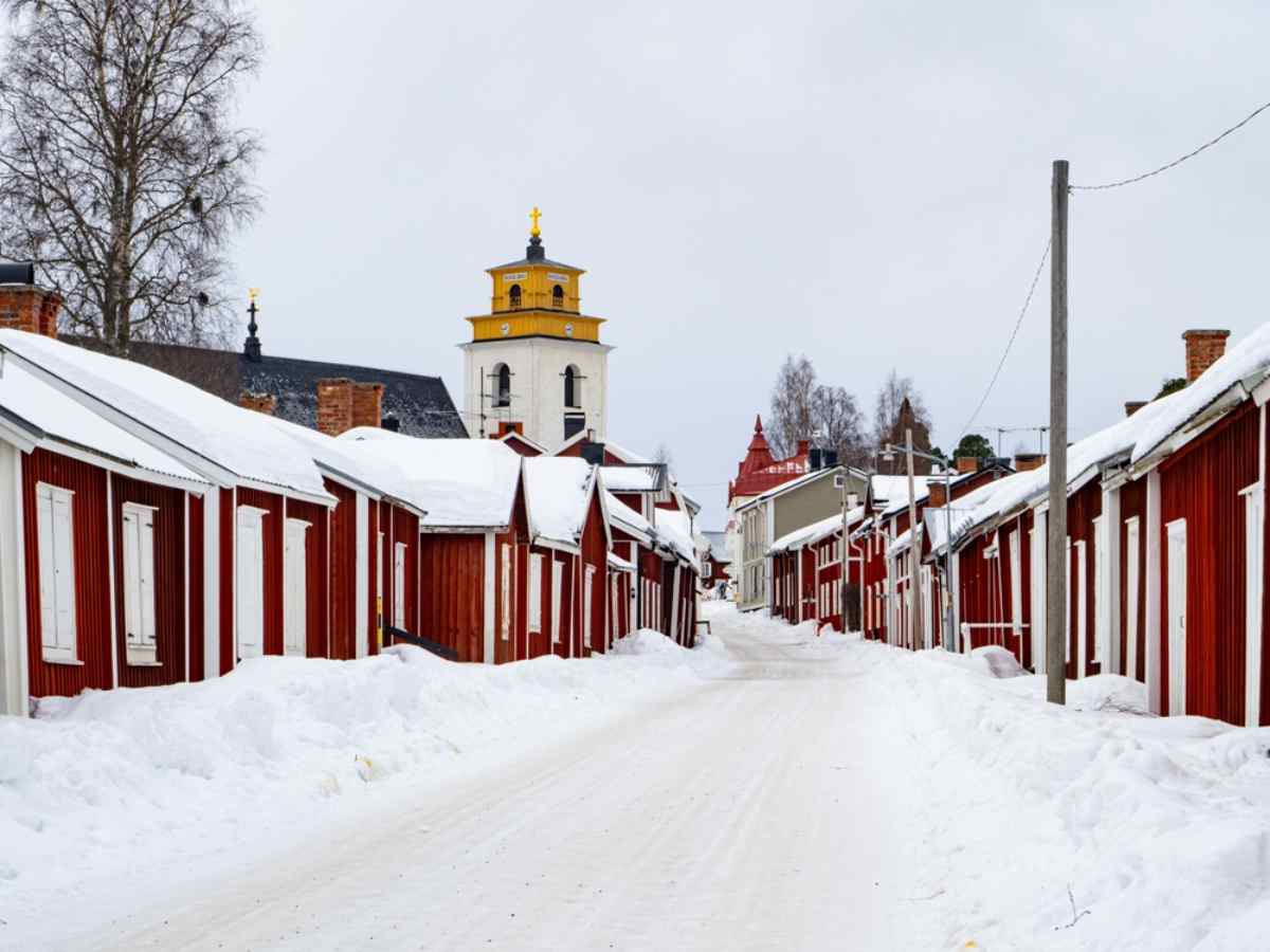 Gammelstad Church Town Snowy street of red wooden houses in Gammelstad Church Town.