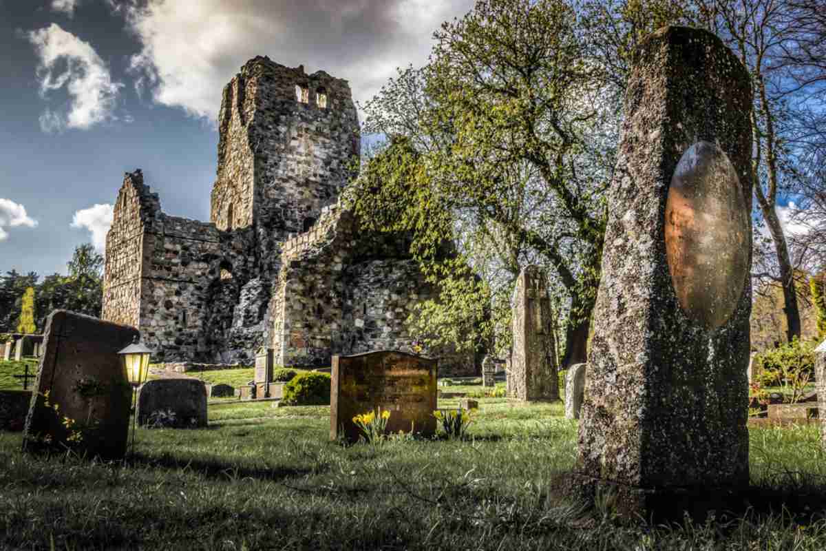 Medieval church ruin and old gravestones in Sigtuna, Sweden, a peaceful stop on a day trip from Stockholm by car.